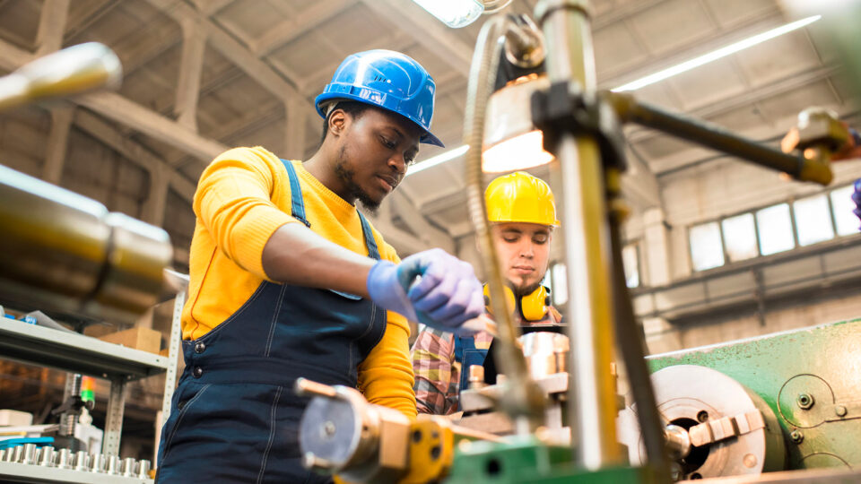 Two workers in a factory